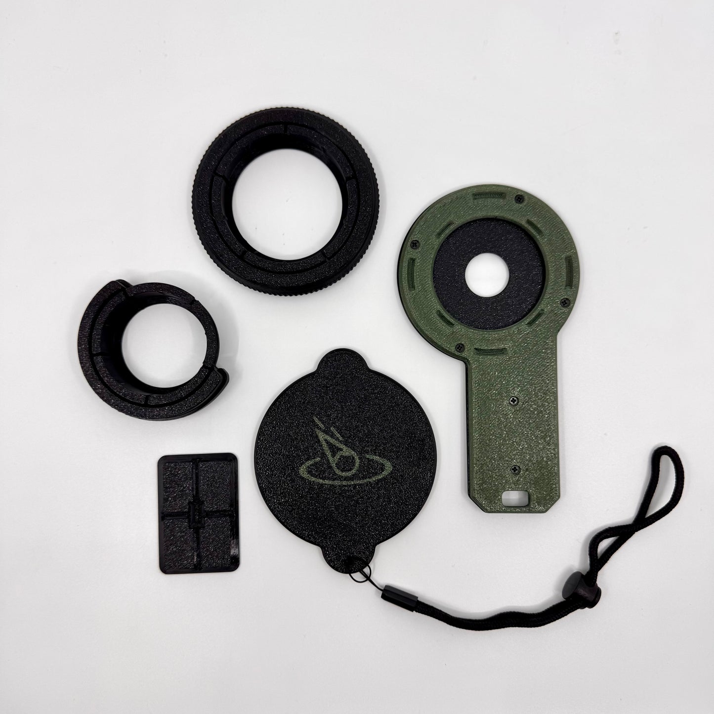 Collection of camera lens components on a white background